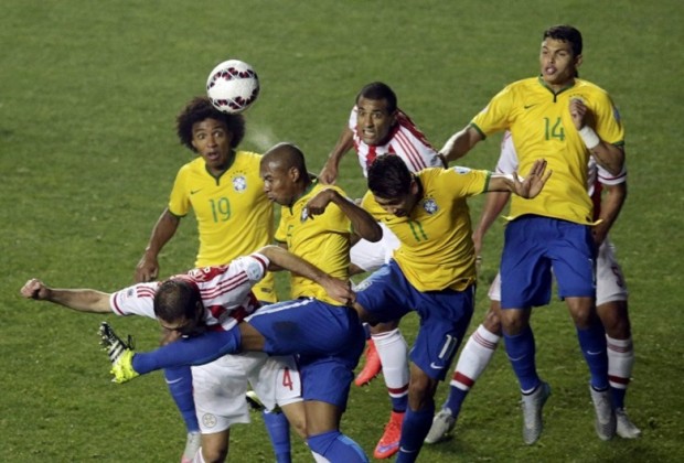 Brazil's Fernandinho heads the ball during the Copa America 2015 quarter-finals soccer match against Paraguay at Estadio Municipal Alcaldesa Ester Roa Rebolledo in Concepcion